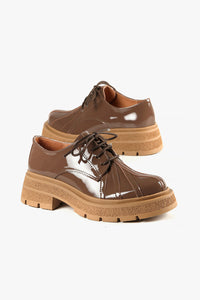 Shiny brown leather lace up shoes