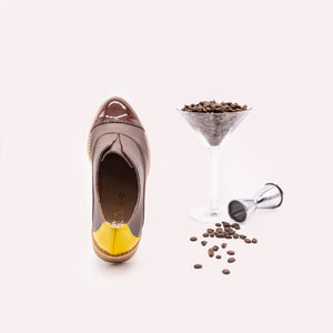 Brown oxfords with yellow heel