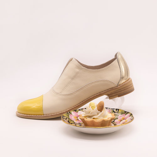 Cream oxfords with yellow toe and gold heel