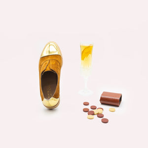 Tan suede oxfords with gold toe and heel