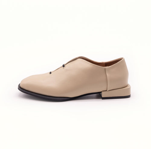 Side view of beige shoe