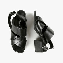 Load image into Gallery viewer, Top and side view of black criss cross strap sandals with block wood heels