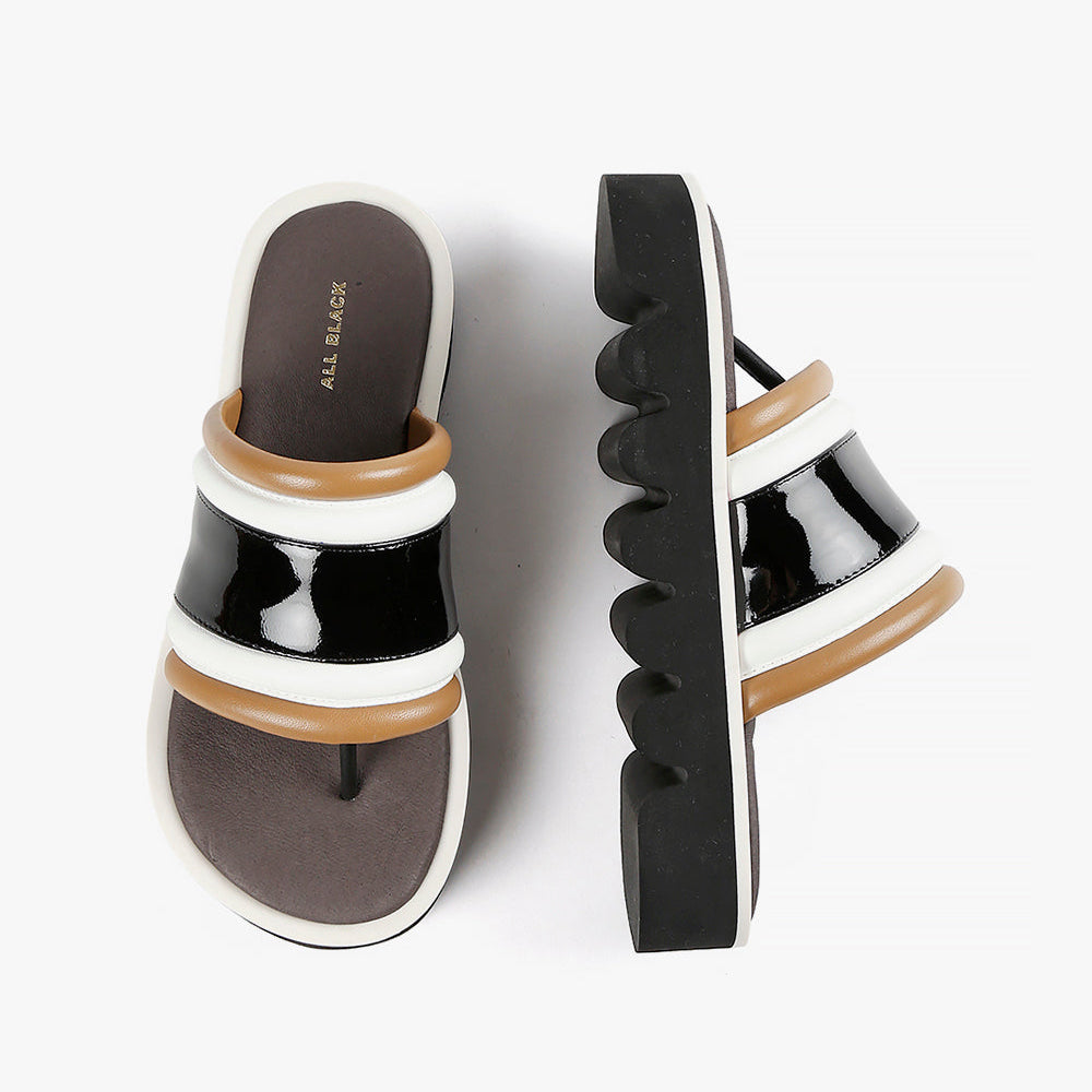 Black white and tan flatform slides