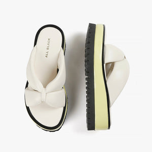Ivory leather slide sandal with yellow and black sole