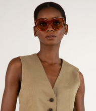 Load image into Gallery viewer, woman wearing orange sunglasses