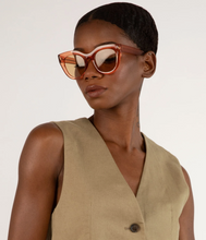 Load image into Gallery viewer, woman wearing orange sunglasses looking to side