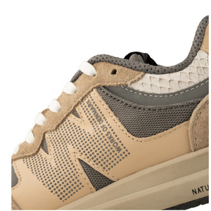 Tan and grey lace up sneaker close up