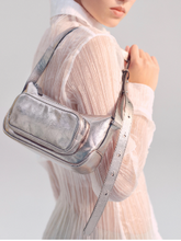 Load image into Gallery viewer, Model with white shirt carrying silver bag