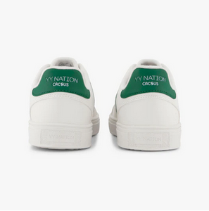 Back of sneaker with green accent