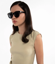 Load image into Gallery viewer, Woman wearing black sunglasses