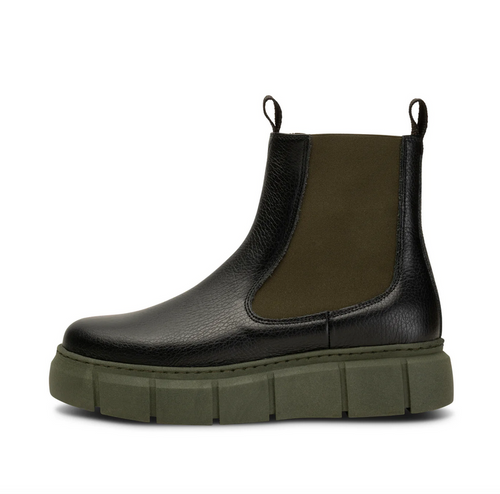 Black Chelsea boot with green lug sole