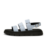 blue suede strappy sandal with black lug sole side view