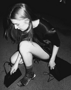 woman kneeling wearing purple shimmery ankle socks