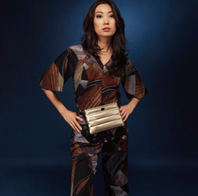 Load image into Gallery viewer, Gold crossbody bag worn by model