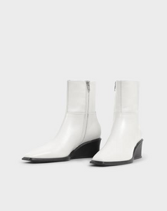 White ankle boots with side zip and black wedge heel