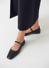 Load image into Gallery viewer, Black Mary Jane flat shoes worn with long black skirt