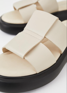 Close up off white leather slide sandal