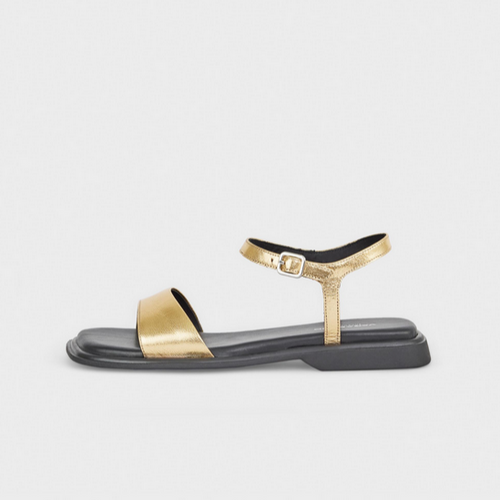 Gold sandals with black sole 