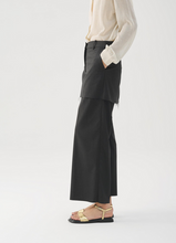 Load image into Gallery viewer, Gold flat sandals worn with black pants and cream shirt