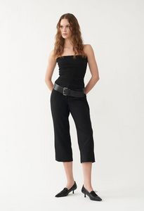 Model wearing black heels with black outfit