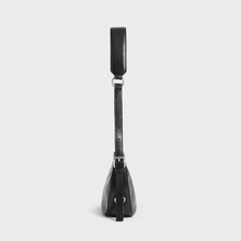 Load image into Gallery viewer, Side view of black leather shoulder handbag