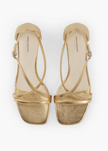 Load image into Gallery viewer, top view of crossed straps on gold sandal