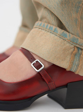 Load image into Gallery viewer, Close up of buckle detail of red Mary Janes worn with jeans