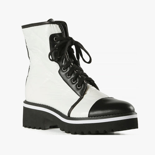 White puffy and black leather combat boot