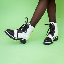 Load image into Gallery viewer, Quilted white nylon and black leather boots worn with black tights
