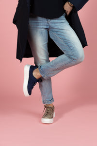 Model wearing Tan snakeskin chunky sneaker and Navy nubuck and embossed leather chunky sneaker