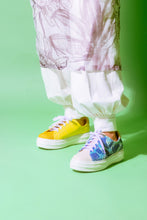 Load image into Gallery viewer, Model wearing Tilapia leather Blue-Teal and Gold Chunky Sneaker and Yellow leather chunky sneaker