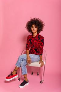 Model wearing Black embossed snakeskin leather chunky sneaker and Red leather chunky sneaker