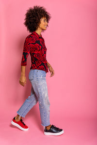 Model wearing Black embossed snakeskin leather chunky sneaker and Red leather chunky sneaker