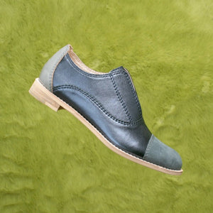 Grayish blue metallic leather slip-on flat oxfords.