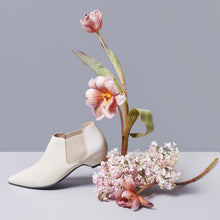 Load image into Gallery viewer, Off-White pony-hair bootie with off-white patent leather heel.