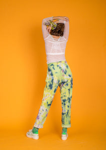 Model wearing Green and Gold Tie Dye chunky sneakers