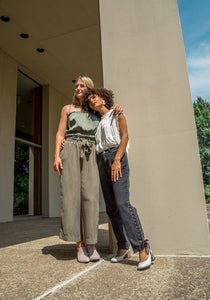 2 Women wearing Boots and Pumps