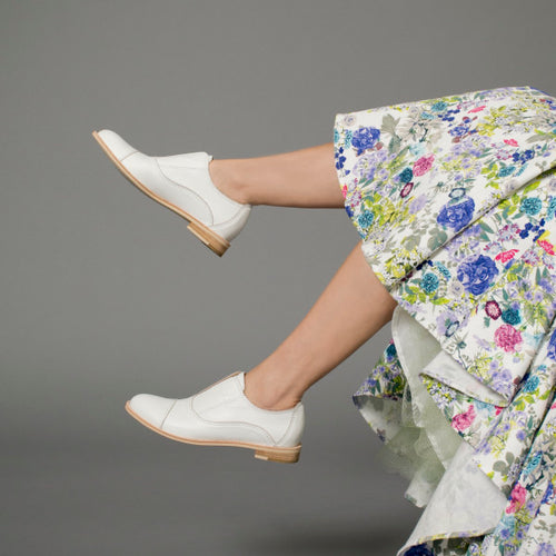 Model wearing White leather oxfords