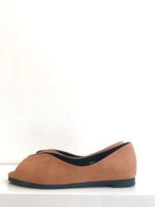 Side view of tan matte leather flat shoes