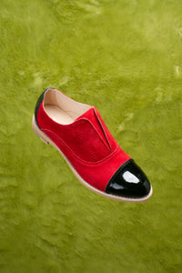 Red suede and patent leather oxford flats.