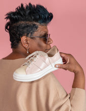 Load image into Gallery viewer, Model holding Pink and Cream chunky sneaker