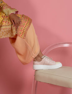 Model wearing Pink and Cream chunky sneaker