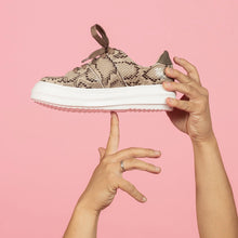 Load image into Gallery viewer, Tan snakeskin chunky sneaker held by model