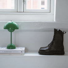 Load image into Gallery viewer, Modern mid calf boot on shelf with books and lamp