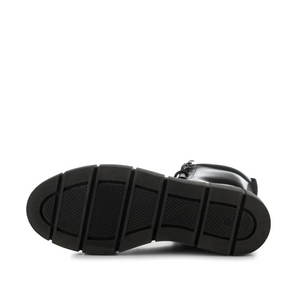Black lug sole of mid calf boot