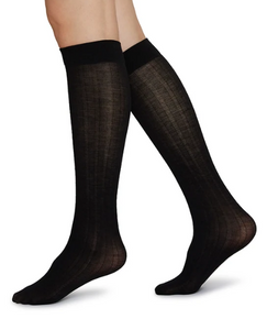 sheer black knee high socks on womans legs